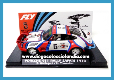 PORSCHE 911 " RALLY SAFARI 1978 / B. WALDEGARD " DE FLY CAR MODEL REF / A2100 . REFERENCIA DE LA NUEVA FLY . ¡ PARRILLA DELANT . MUY FRÁGIL ! . TODOS LOS COCHES DE LA WEB, SON COMPATIBLES CON CIRCUITOS SCALEXTRIC, SUPERSLOT, NINCO Y CARRERA... www.diegocolecciolandia.com . Tienda Scalextric Madrid . Tienda Slot Madrid . Tienda Scalextric España . Tienda Slot España .
