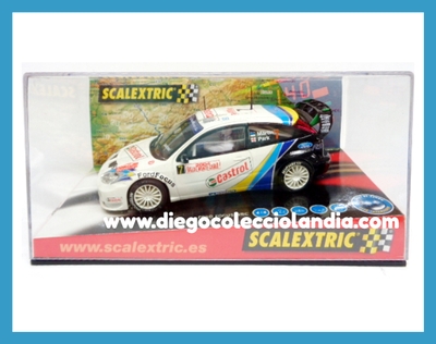 FORD FOCUS WRC " RALLYE MONTE CARLO 2004 " DE SCALEXTRIC REF/ 6147 . TODOS LOS COCHES DE SLOT DE LA WEB, SON COMPATIBLES CON CIRCUITOS SCALEXTRIC, SUPERSLOT, NINCO Y CARRERA................. www.diegocolecciolandia.com . Tienda Scalextric Slot Madrid, España. Slot Cars Shop Spain.