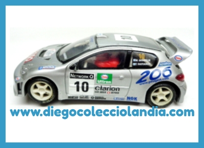 PEUGEOT 206 WRC #10 " WORLD CHAMPION 2000 / GRONHOLM " DE SCALEXTRIC REF / 6064 . USADO EN PERFECTO ESTADO SIN CAJA .CON DESGASTE NORMAL DE TRENCILLAS Y NEUMÁTICOS. DE VITRINA . TODOS LOS COCHES DE LA WEB, SON COMPATIBLES CON CIRCUITOS SCALEXTRIC, SUPERSLOT, NINCO Y CARRERA... www.diegocolecciolandia.com . Tienda Scalextric Slot Madrid España . Slot Cars Shop Madrid Spain .