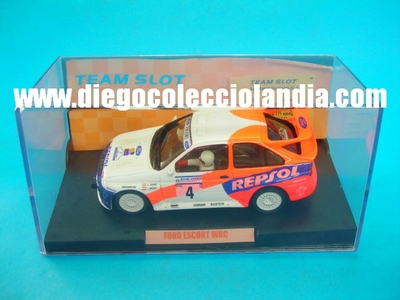 Ford Escort WRC #4 " Ganador Rally Indoinesia 1996 ". Carlos Sainz / Luis Moya. Coche de Resina .Edición Limitada y numerada de 171 unidades. TODOS LOS COCHES DE SLOT DE LA WEB, SON COMPATIBLES CON CIRCUITOS SCALEXTRIC, SUPERSLOT, NINCO Y CARRERA............  www.diegocolecciolandia.com . Slot Cars Shop Madrid, Spain. Tienda Slot, Scalextric Madrid, España.
