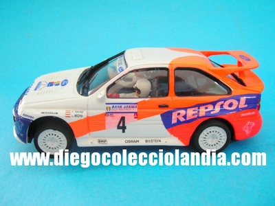 Ford Escort WRC #4 " Ganador Rally Indoinesia 1996 ". Carlos Sainz / Luis Moya. Coche de Resina .Edición Limitada y numerada de 171 unidades. TODOS LOS COCHES DE SLOT DE LA WEB, SON COMPATIBLES CON CIRCUITOS SCALEXTRIC, SUPERSLOT, NINCO Y CARRERA............  www.diegocolecciolandia.com . Slot Cars Shop Madrid, Spain. Tienda Slot, Scalextric Madrid, España.